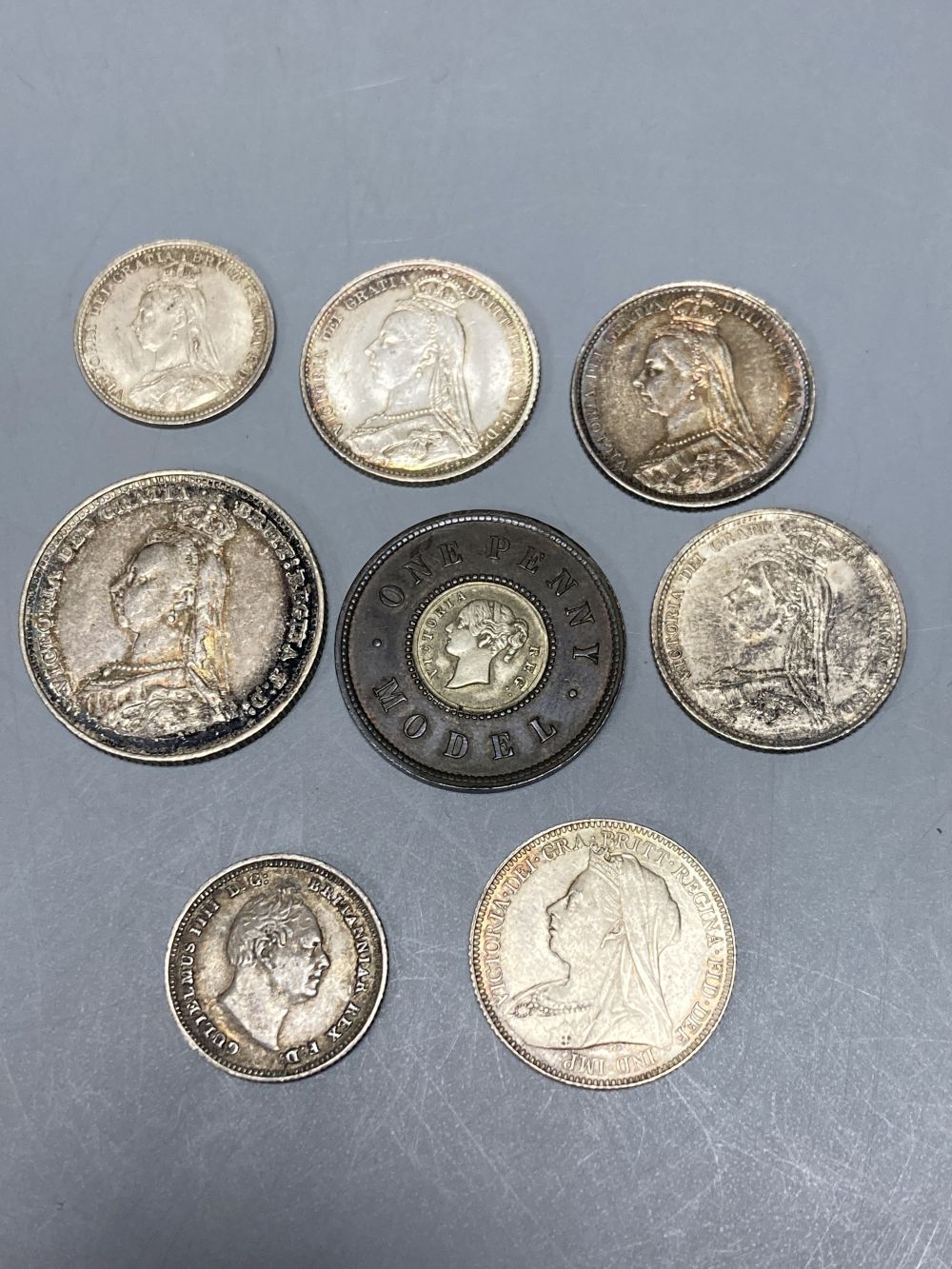Great Britain, Queen Victoria, 1837-1901, One Penny Model, four sixpence coins and a threepence together with a William IV four pence,